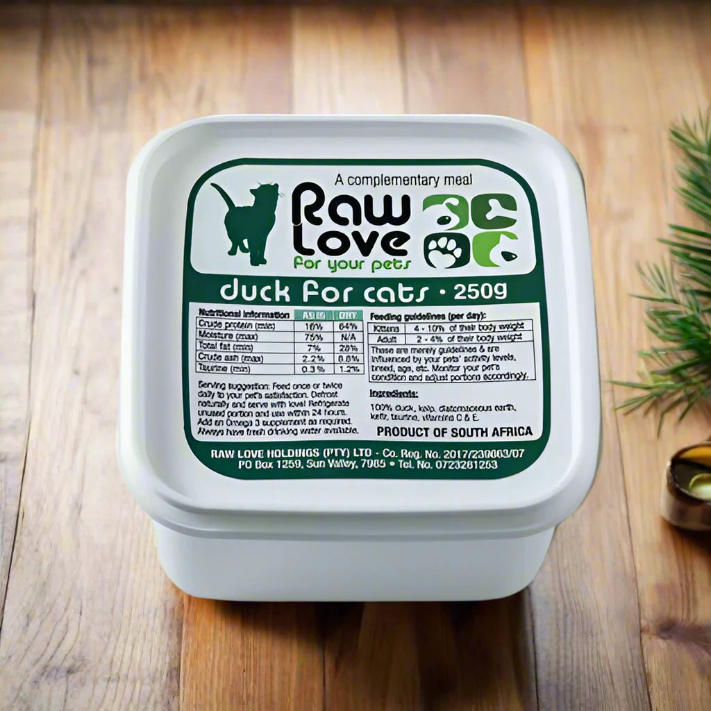 Raw Love Duck for Cats: Packaging showcasing 100% free-range raw duck meat, enriched with probiotic-rich kefir, kelp, taurine, and unfiltered apple cider vinegar. Grain-free and preservative-free, this nutritious meal promotes feline health and happiness.